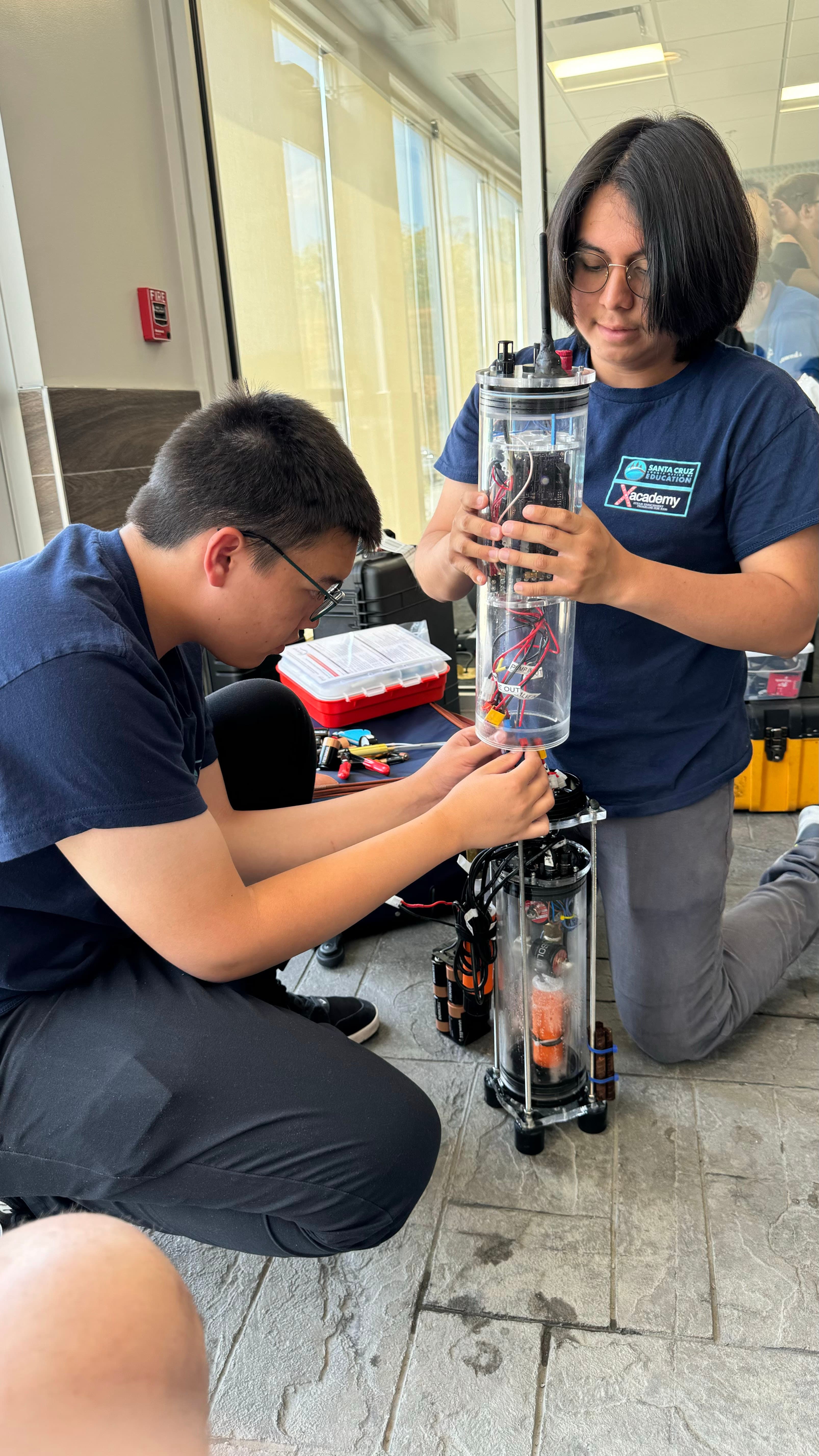 Two team members fixing the float