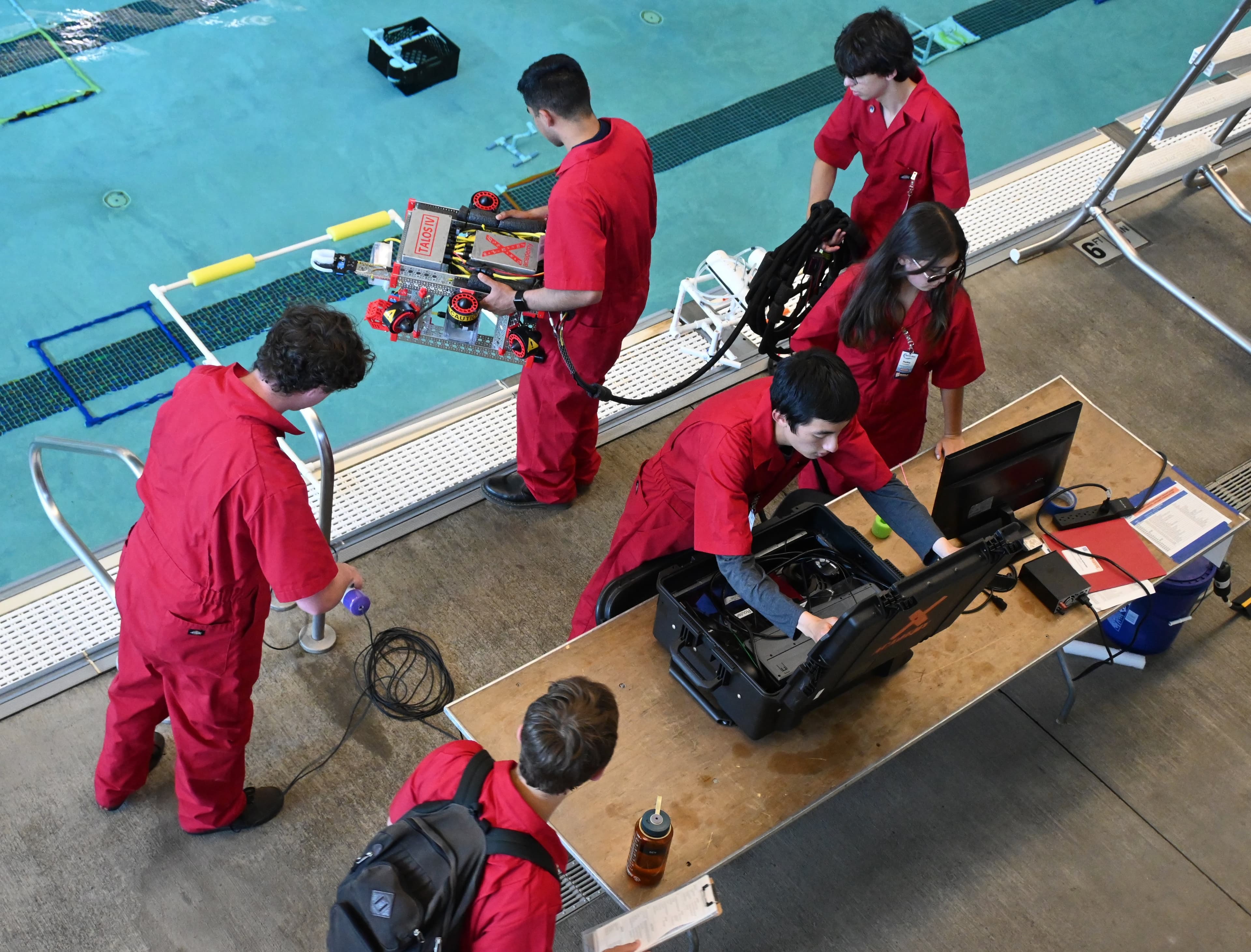 Team on their second run preparing to deploy their ROV